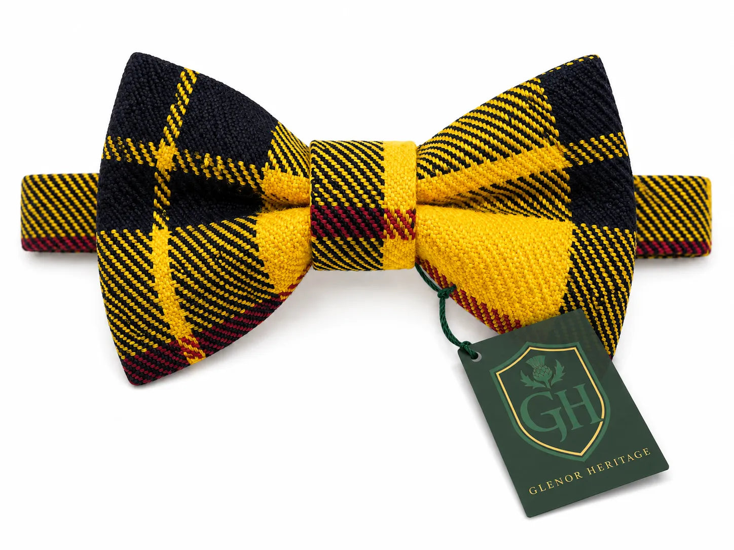 A pre-tied bow tie with a yellow, black, and burgundy plaid pattern, shown with a green 'Glenglass Heritage' brand tag on a white background.